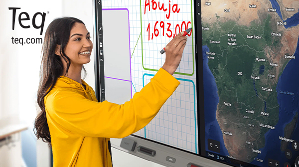 Woman in yellow shirt writing on a SMART Board with a split screen. Teq logo.