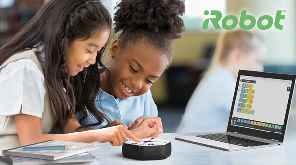 Students smiling while using the iRobot Root. iRobot logo.