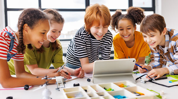 Students looking at a tablet screen