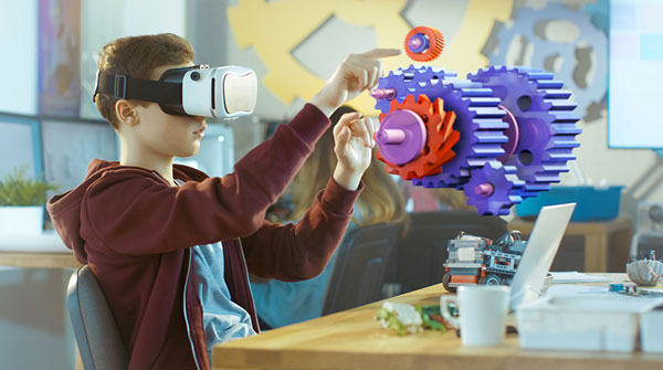 Student using an Inspirit VR headset to visualize a contraption
