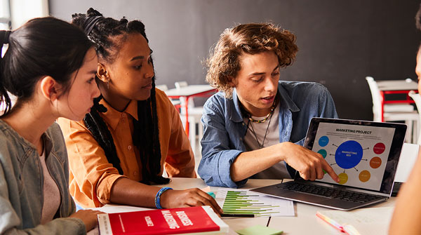 Students working together using a tablet