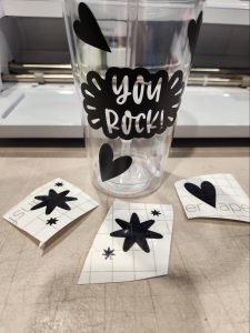 A decorated cup that says "You rock!"