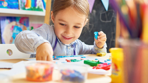 Child playing with clay