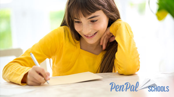 A young girl building connections with PenPal Schools.